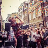 Andrew Derbyshire performs in Archer Street, Soho, for London Pride 2022